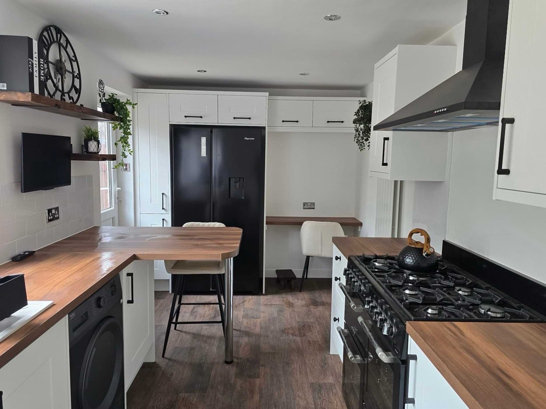 New kitchen re-design, white cupboards with a dark oak top